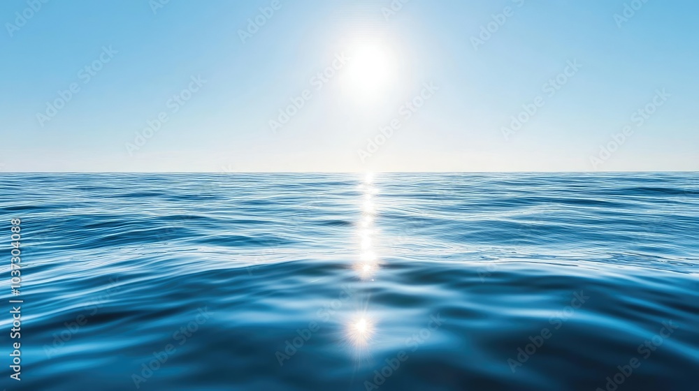 A reflective ocean surface with calm waves gently moving across a sunlit horizon, under a clear sky. A reflective ocean surface with calm waves gently moving across a sunlit horizon, under a clear sky.