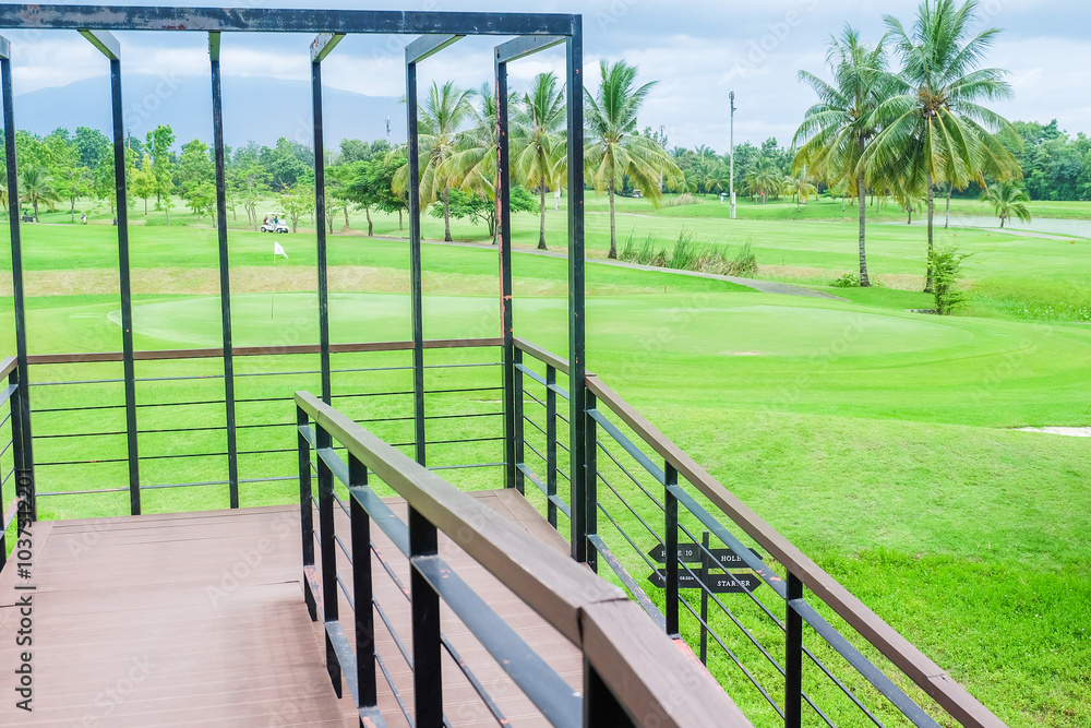 Panorama view of Golf Course where the turf is beautiful and green, Golf cart,Golf cart in fairway of golf course,Golf course with a rich green turf beautiful scenery,sport club,copy space. Panorama view of Golf Course where the turf is beautiful and green, Golf cart,Golf cart in fairway of golf course,Golf course with a rich green turf beautiful scenery,sport club,copy space.