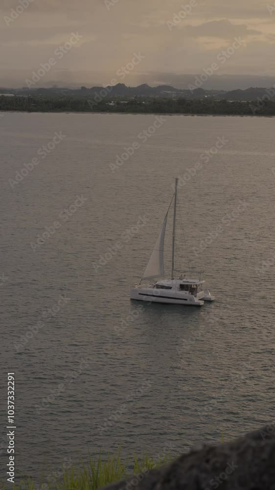 Boat Sailing Along The Coast Of San Juan El Morro During The Sunset. Boat Sailing Along The Coast Of San Juan El Morro During The Sunset.
