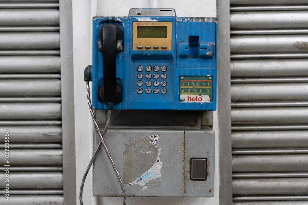 Public phone booth in Sarawak, Malaysia which supports Kadfon (Phone Cards) - old, broken, unused technology Public phone booth in Sarawak, Malaysia which supports Kadfon (Phone Cards) - old, broken, unused technology