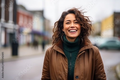 Portrait of a beautiful young woman smiling in an urban setting.