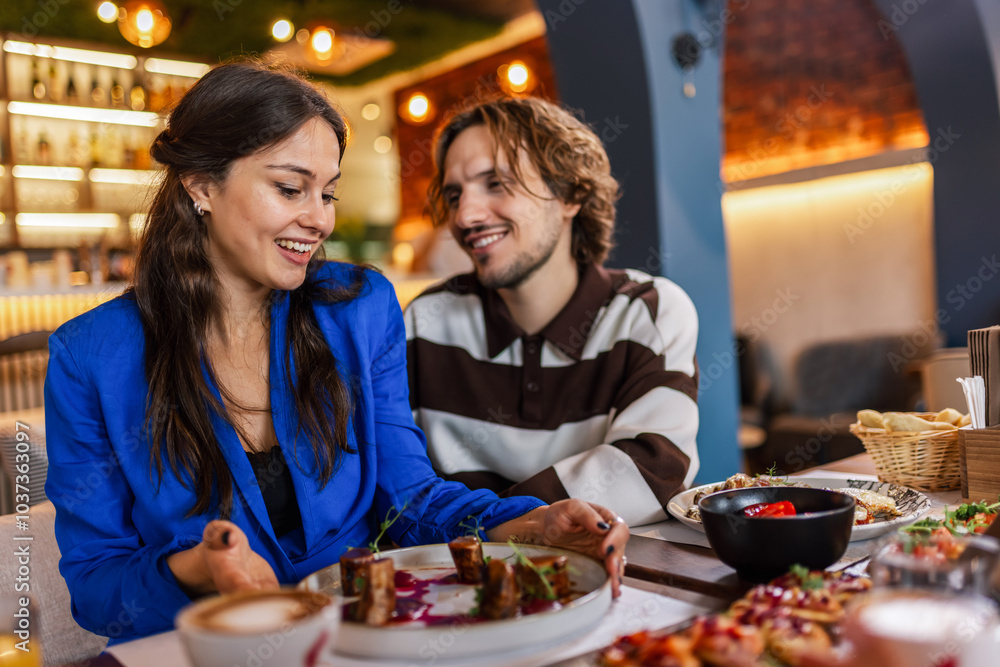 Couple eating in a restaurant. Food looks delicious and tasty. Food and drink concept. Couple eating in a restaurant. Food looks delicious and tasty. Food and drink concept.