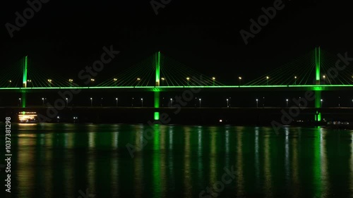 4K night timelapse hyperlapse footage of the lit up Atal Setu Bridge and activities in mandovi river in Panaji, Goa. Places to visit in Goa when on vacation photo