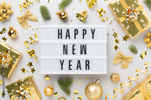 Happy New Year with decor on color background, top view