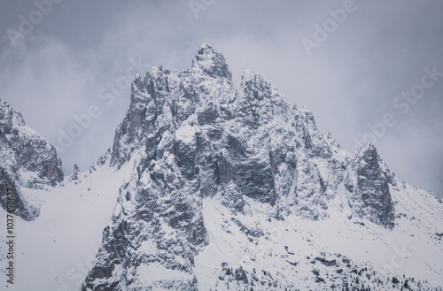 Close-up on a snowy peak close to the Croda Rossa d'Ampezzo on a sunny day with a blue sky in the Dolomites. View from the Forte di Prato Piazza on Duerrenstein. photo