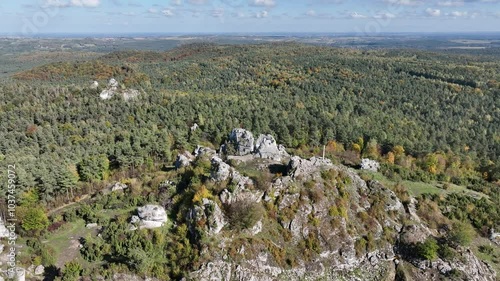 Aerial drone view of Zborow Hill, Poland. Limestone rock formation at peak of Gora Zborow, Podlesice, Poland. Krakow Czestochowa Upland. Polish Jurassic Highland Mountainl Zborow in autumn. photo