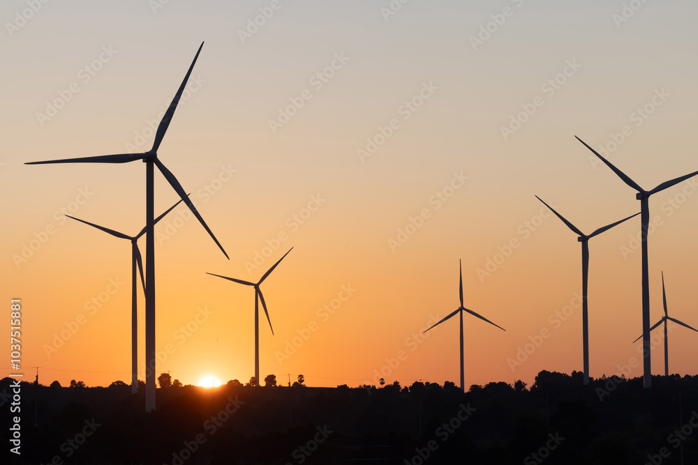 Obraz premium View of wind turbine against sunset sky