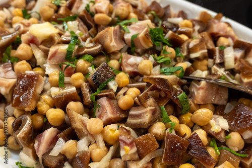 meal made with pig's ear, chickpeas, onion and lettuce, north Portugal photo