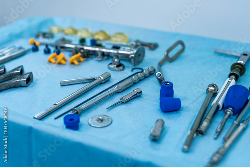 Fotografie Surgical tools on a blue drape