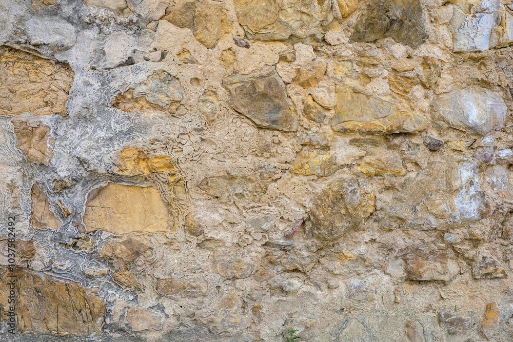 Parede de pedras velhas. Imagem de fundo rugoso e degradado. Parede de pedras velhas. Imagem de fundo rugoso e degradado.