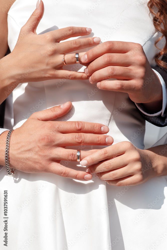 Newlyweds exchange rings, groom puts the ring on the bride's hand. Newlyweds exchange rings, groom puts the ring on the bride's hand.