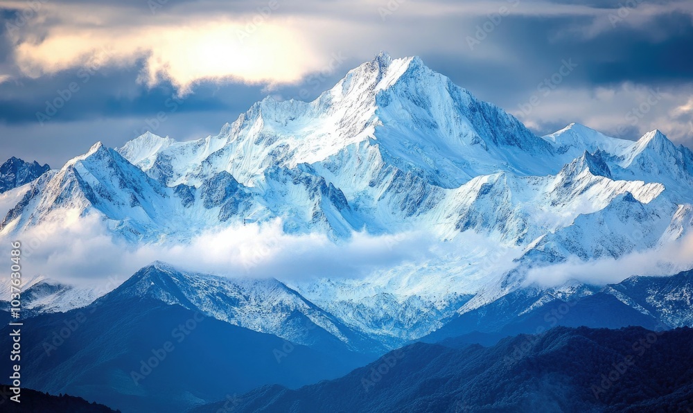 Fototapeta premium The mountains are covered in snow and the sky is cloudy