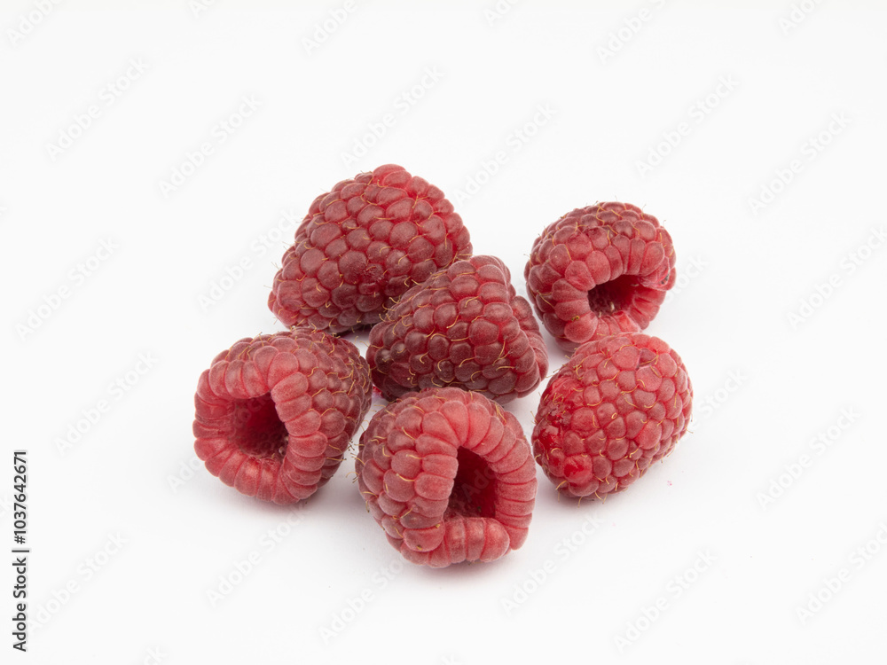 Fresh Ripe Raspberries Isolated on White Background with Bright Colors in Close-Up Fresh Ripe Raspberries Isolated on White Background with Bright Colors in Close-Up