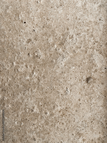 Textured stone concrete surface with natural earthy tones. Rough, uneven pattern with rustic and organic vibes, ideal for backgrounds, construction themes or design projects. Raw, authentic look