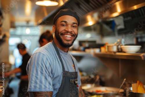 Portrait of a smiling American chef in restaurant kitchen