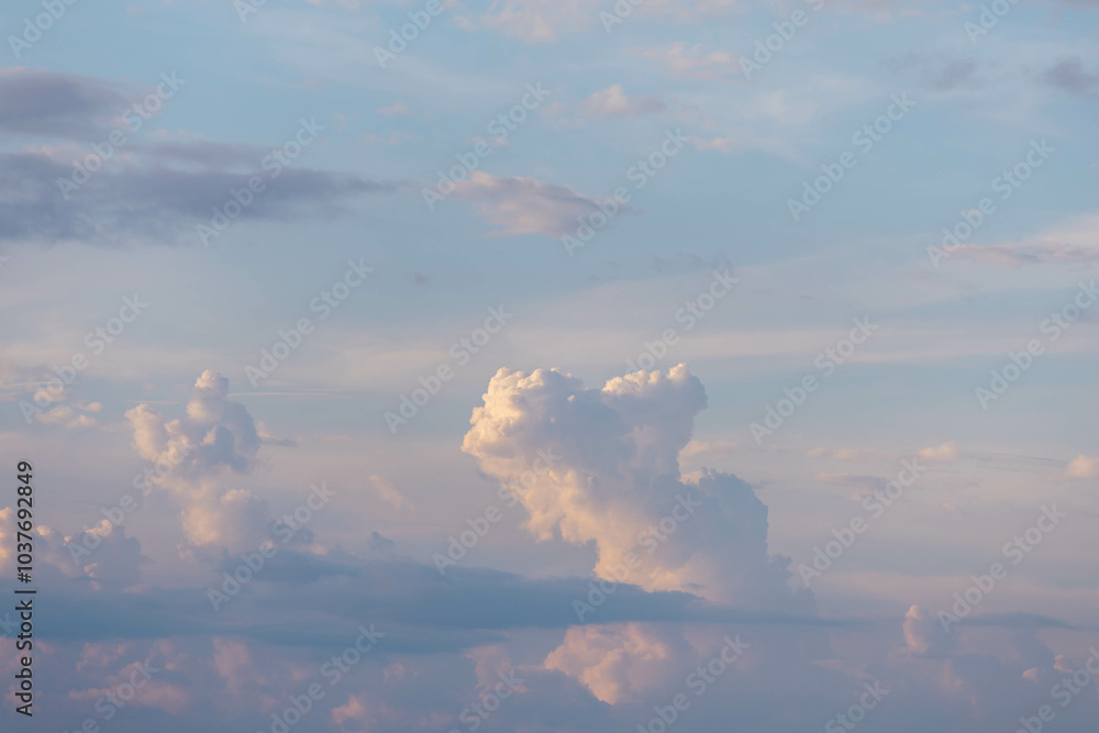 The image features soft, fluffy clouds painted in pastel colors against a clear blue sky, creating a tranquil and ethereal atmosphere perfect for reflection and inspiration. The image features soft, fluffy clouds painted in pastel colors against a clear blue sky, creating a tranquil and ethereal atmosphere perfect for reflection and inspiration.