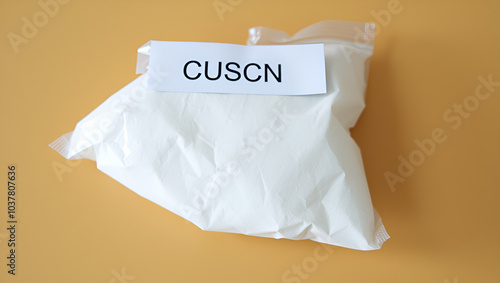 CuSCN copper(I) thiocyanate CAS 1111-67-7 chemical substance in white plastic laboratory packaging photo