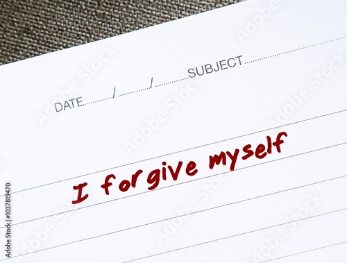 Notebook with message text I FORGIVE MYSELF, positive affirmation of learning to fully accept whatever you did - forgive and let go any resentment you have made significant mistakes photo