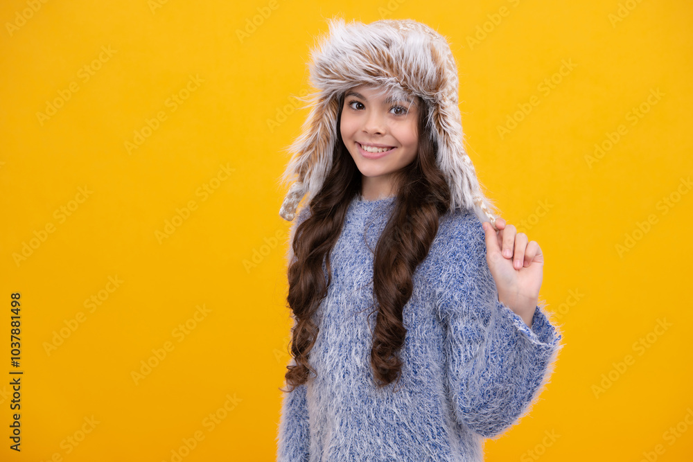School girl in winter clothes and warm hat. Winter holiday vacation. Child fashion model. Happy girl face, positive and smiling emotions. School girl in winter clothes and warm hat. Winter holiday vacation. Child fashion model. Happy girl face, positive and smiling emotions.