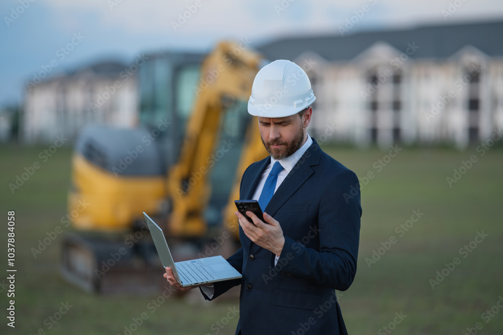 Civil engineer worker at a construction site. Engineer man in front of house background. Confident engineer worker at modern home building construction. Hispanic civil engineer in helmet. Civil engineer worker at a construction site. Engineer man in front of house background. Confident engineer worker at modern home building construction. Hispanic civil engineer in helmet.