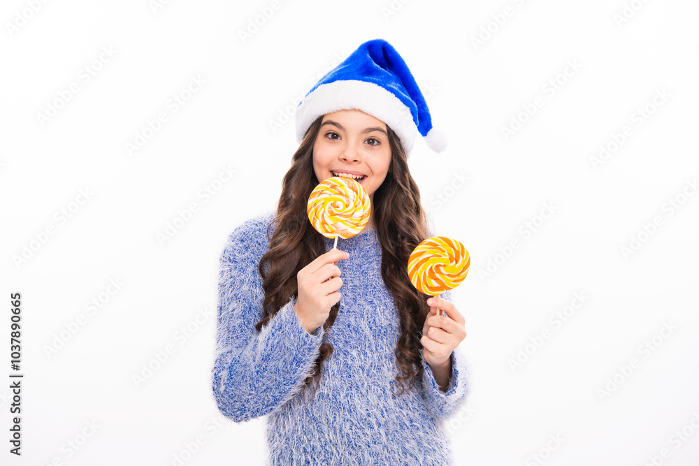 Winter teen girl hold christmas lollipop. Teen girl in winter sweater on white isolated background. Portrait of teenager girl for new year and christmas banner. Winter teen girl hold christmas lollipop. Teen girl in winter sweater on white isolated background. Portrait of teenager girl for new year and christmas banner.