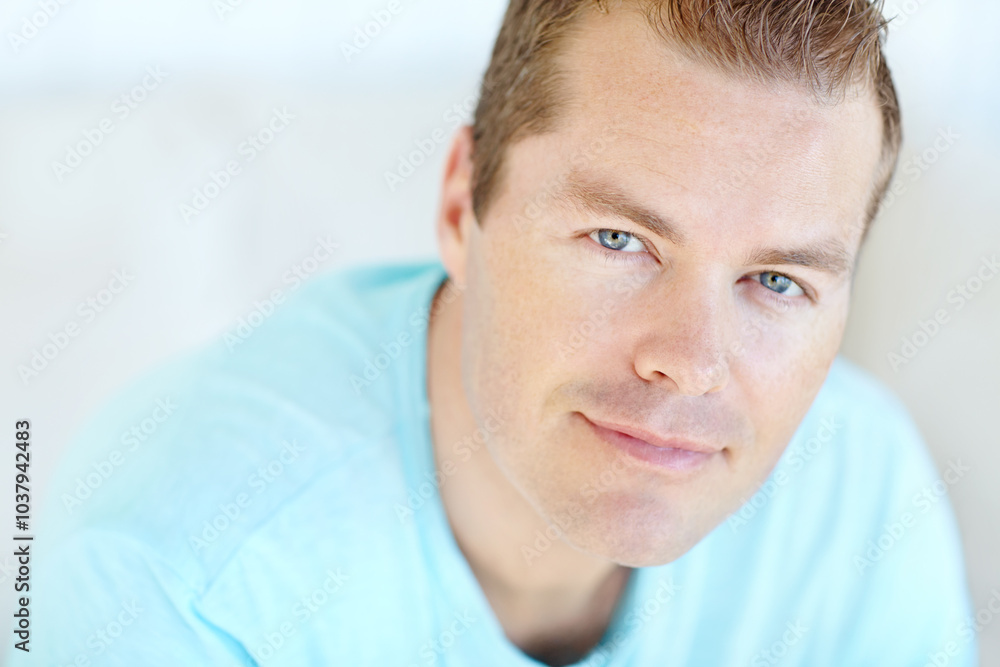 Fototapeta premium Confident, relax and portrait of man in home with positive attitude, chilling or resting in living room. Smile, calm and face of person from Germany with happiness and pride in lounge at apartment.