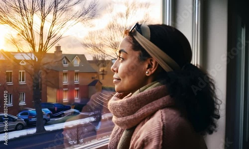 contemplating female watching outside window