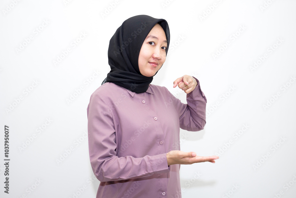 portrait of Indonesian Asian woman wearing shirt and hijab pointing with one and two hands to right, left and front. pointing to empty direction for advertising space.. Isolated on white background portrait of Indonesian Asian woman wearing shirt and hijab pointing with one and two hands to right, left and front. pointing to empty direction for advertising space.. Isolated on white background