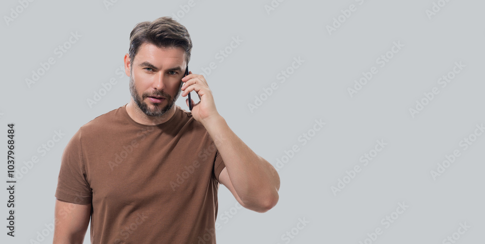 Portrait of handsome man using smartphone, chatting, making post on social media. Business man call on phone isolated over studio background. Banner for header, copy space. Portrait of handsome man using smartphone, chatting, making post on social media. Business man call on phone isolated over studio background. Banner for header, copy space.
