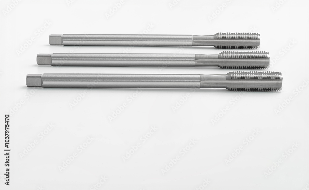 set of thread tap cutting isolate on white background material high speed steel for threading metalwork. set of thread tap cutting isolate on white background material high speed steel for threading metalwork.