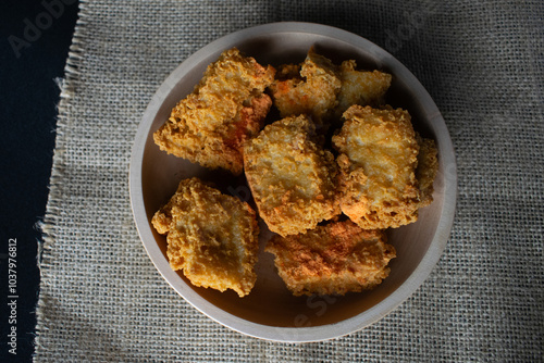 crispy tofu in a wooden bowl