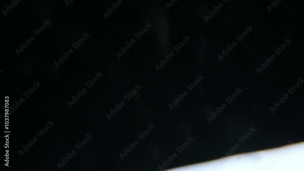 Low angle view of tennis player unpacking outdoors Low angle view of tennis player unpacking outdoors