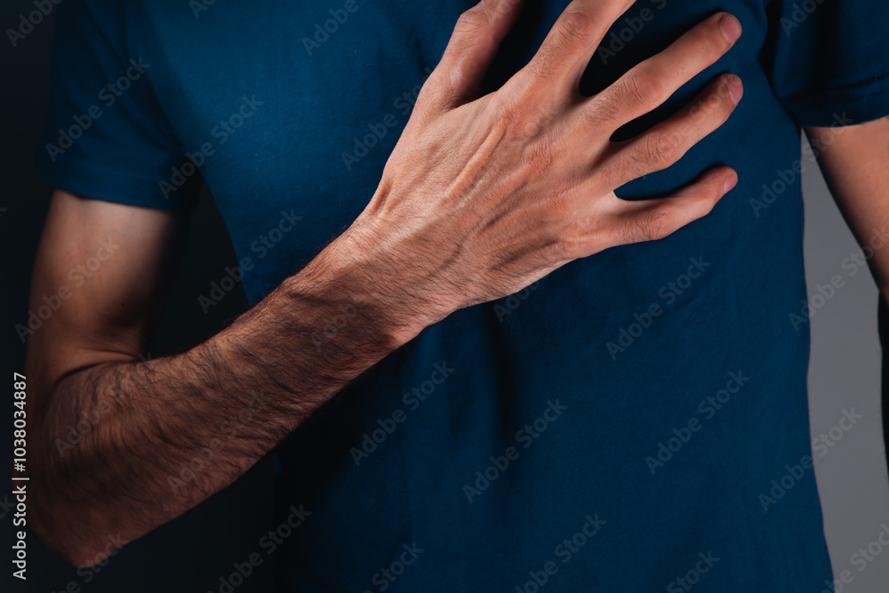 close up of man holding chest with pain, heart attack concept close up of man holding chest with pain, heart attack concept
