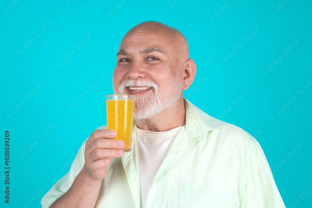 Senior drink orange juice in studio. Elderly man hold glass of orange juice. Man with orange juice. Fruit for aged people. Senior on diet, healthy lifestyle. Studio portrait senior with orange juice. Senior drink orange juice in studio. Elderly man hold glass of orange juice. Man with orange juice. Fruit for aged people. Senior on diet, healthy lifestyle. Studio portrait senior with orange juice.