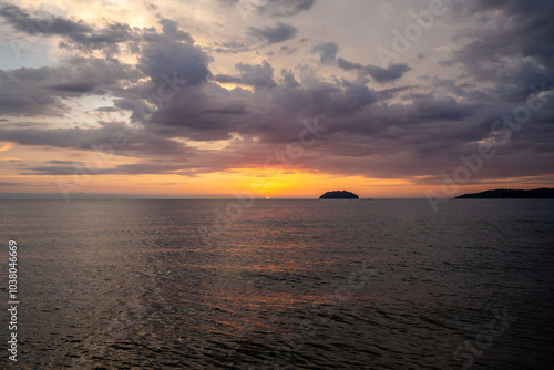 Sunset view from Tanjung Aru Beach, Kota Kinabalu, Sabah, Malaysia (Borneo) with Sulug Island and Manukan Island (Palau Manukan) photo