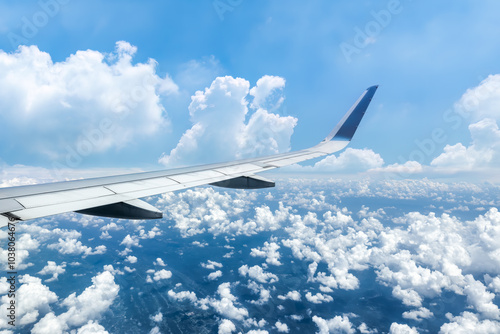 Airplane wing and sky cloudscape in stratosphere