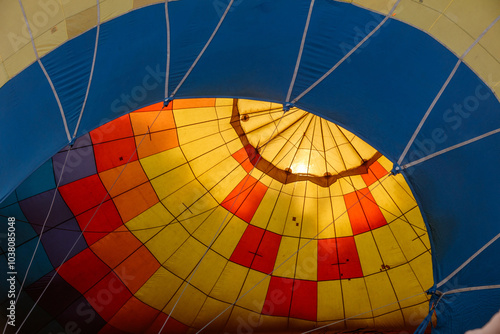 A hot air balloon with a yellow and red pattern on it photo