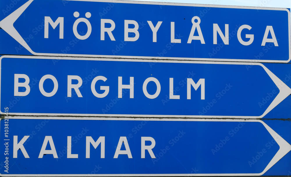 Sign post with directional road signs to the Swedish towns Morbylanga, Borgholm and Kalmar.