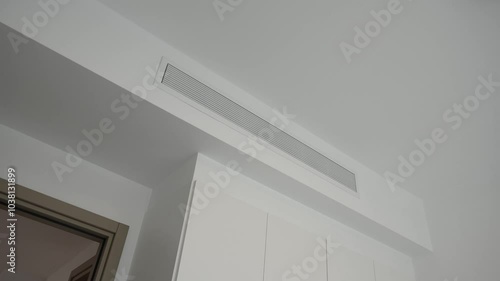 Supply ventilation system on white ceiling. Concept for modern ventilation technology, climate comfort control Interiors and solutions. Slow motion video with copy space.