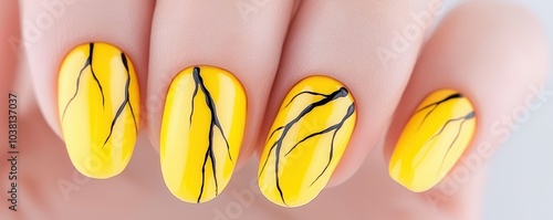 Bright yellow nail art featuring crackle designs gives a vibrant and trendy look, perfect for fashion-forward individuals. photo