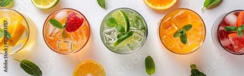 Refreshing cocktails with vibrant colors and garnished with mint leaves, arranged in top down view on white background. Perfect for summer gatherings and celebrations