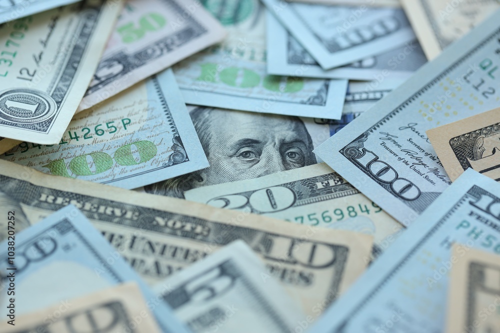 Many dollar bills with different nominations lies in big pile Many dollar bills with different nominations lies in big pile