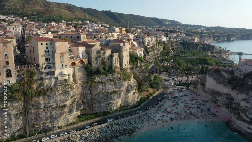 Aerial view of cliffs, historic tourist center of the city, monastery Santuario di Santa Maria dell'Isola di Tropea sunny summer day in Calabria region, Italy