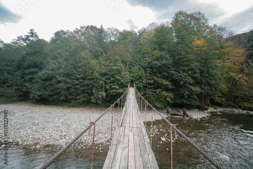 Suspension bridge over the Malaya Laba River, Caucasian Nature Reserve, Russia.