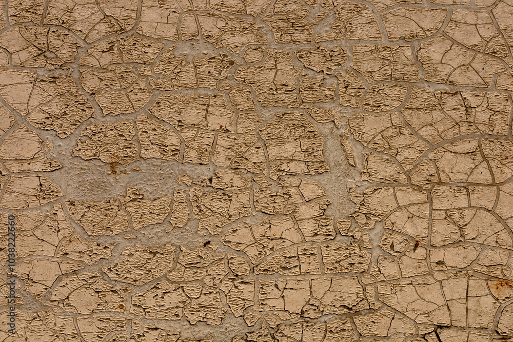 Cracked earth surface under bright sunlight showcases drought conditions in a rural area Cracked earth surface under bright sunlight showcases drought conditions in a rural area