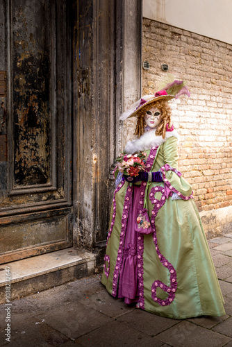 Venice, Italy - February 4, 2024: Pretty costumes worn by a woman during the Venice carnival in Italy photo