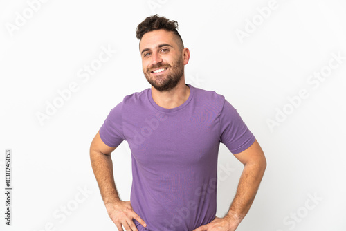 Caucasian man isolated on white background posing with arms at hip and smiling