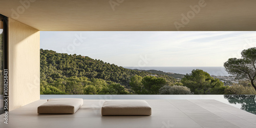 Serene coastal view from a minimalist interior overlooking lush hills and ocean at sunset