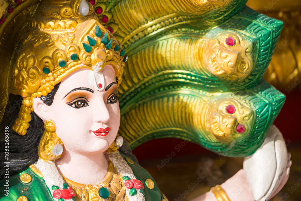 Samut Prakan, Thailand - June, 12, 2024 : Divine Hindu Deity Statue in Thai Temple: A Fusion of Culture and Religion at Samut Prakan, Thailand. Samut Prakan, Thailand - June, 12, 2024 : Divine Hindu Deity Statue in Thai Temple: A Fusion of Culture and Religion at Samut Prakan, Thailand.
