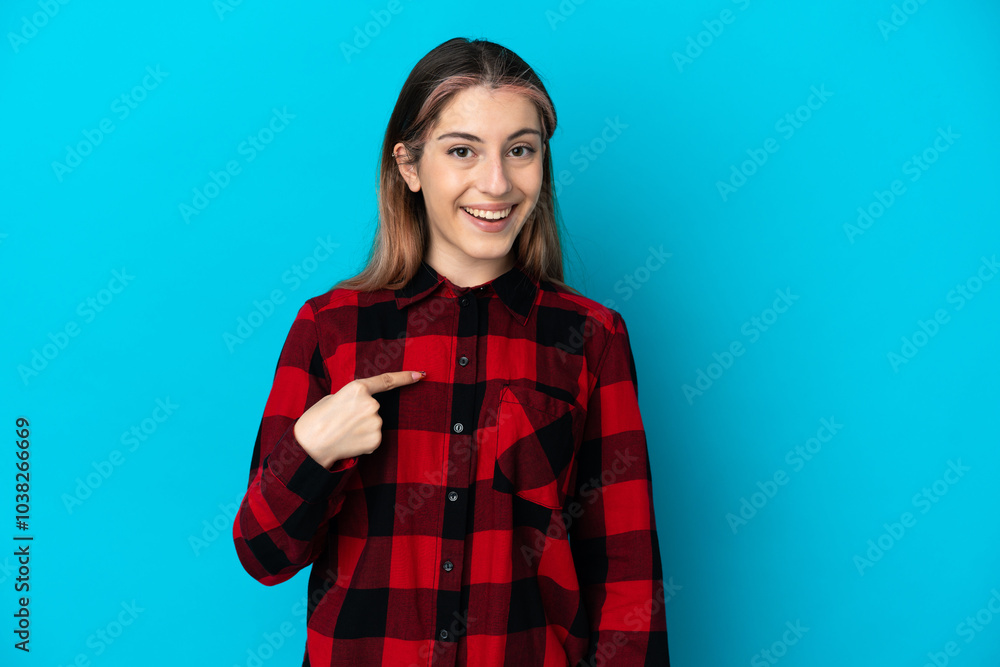 Fototapeta premium Young caucasian woman isolated on blue background with surprise facial expression